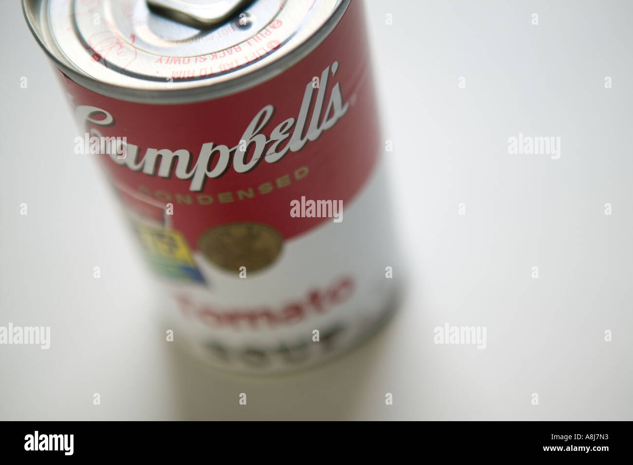 Sudio shot of a can of Campbell s tomato soup sits on a white surface background 2006 Stock Photo