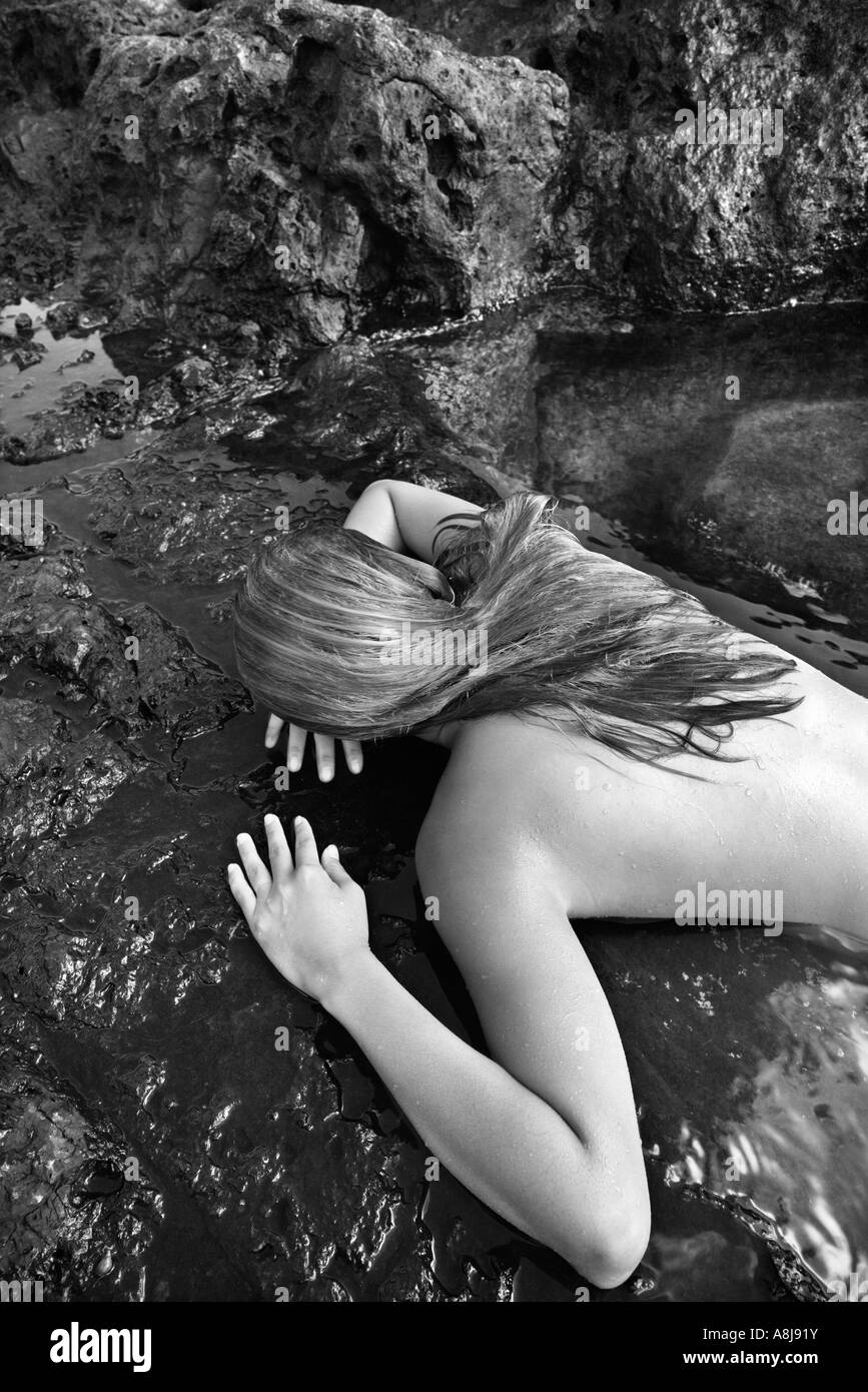 laying face down nude Young nude Asian woman lying face down on rocks Stock Photo - Alamy