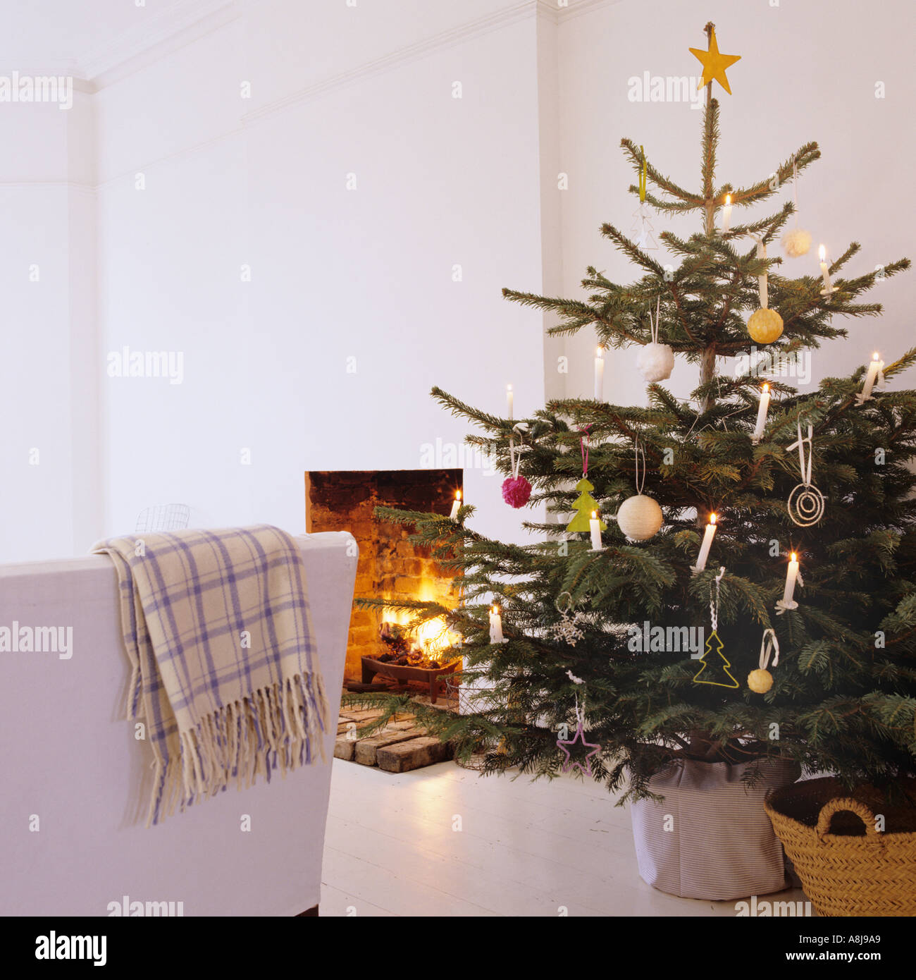 Decorated Christmas tree by open fireplace Stock Photo Alamy