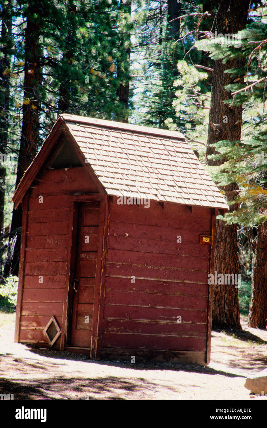 an outhouse in the forest Stock Photo