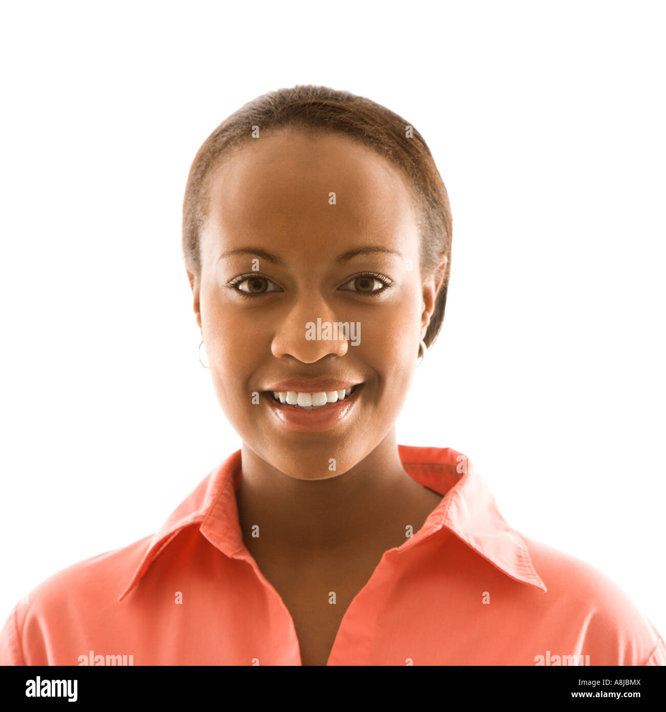 Portrait of African American woman smiling against white background ...