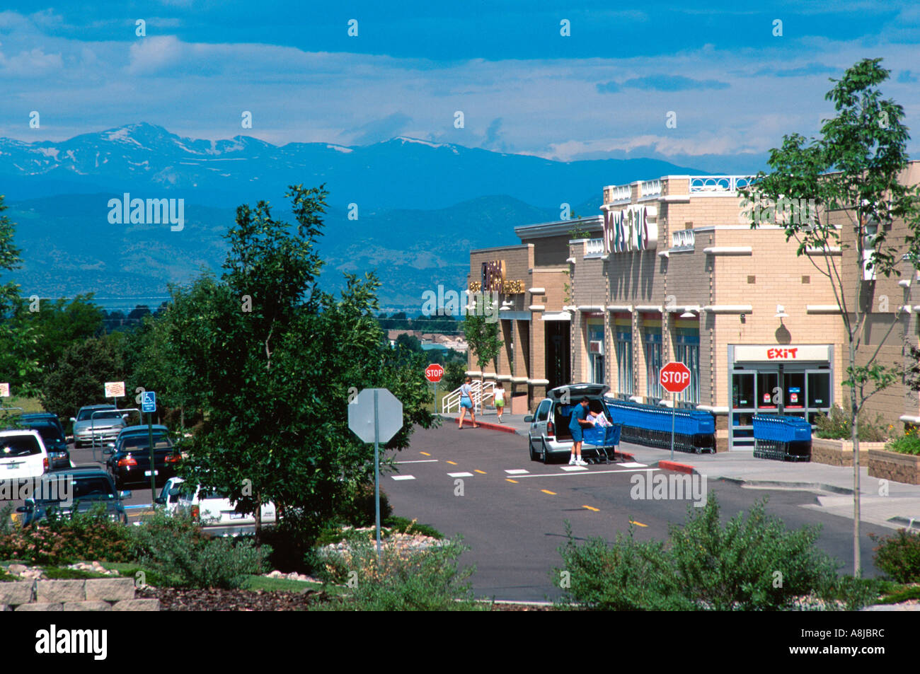 Parking lot shopping mall with Front Range Rocky mountains in background, Denver, Colorado, USA. Stock Photo