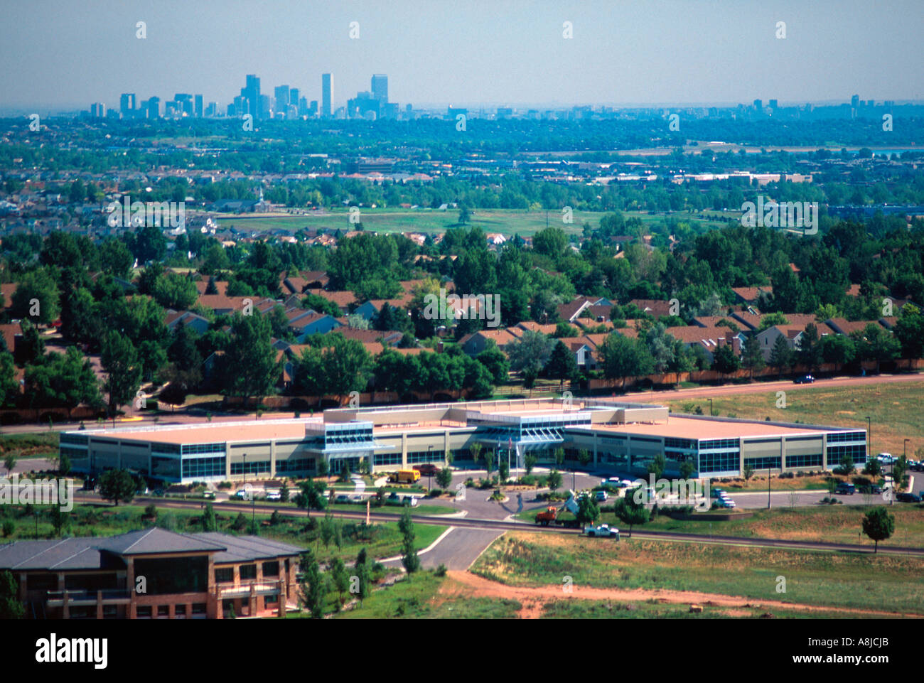 New corporate headquarters building and Denver city skyline Stock Photo Alamy