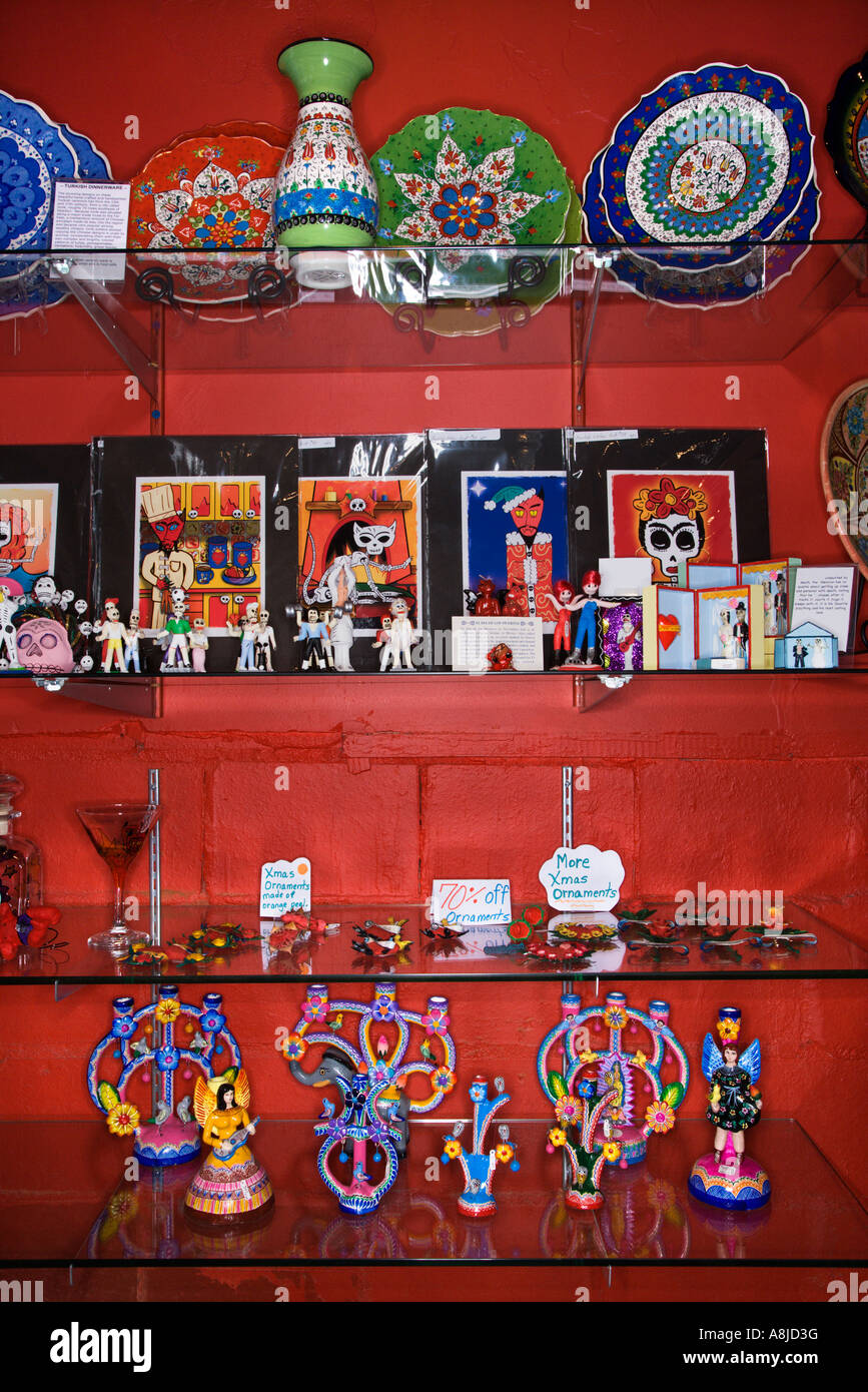 Shelves of unique folk art in retail store Stock Photo Alamy