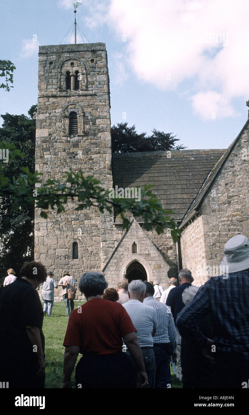 Church go-ers entering the Church on Sunday Stock Photo