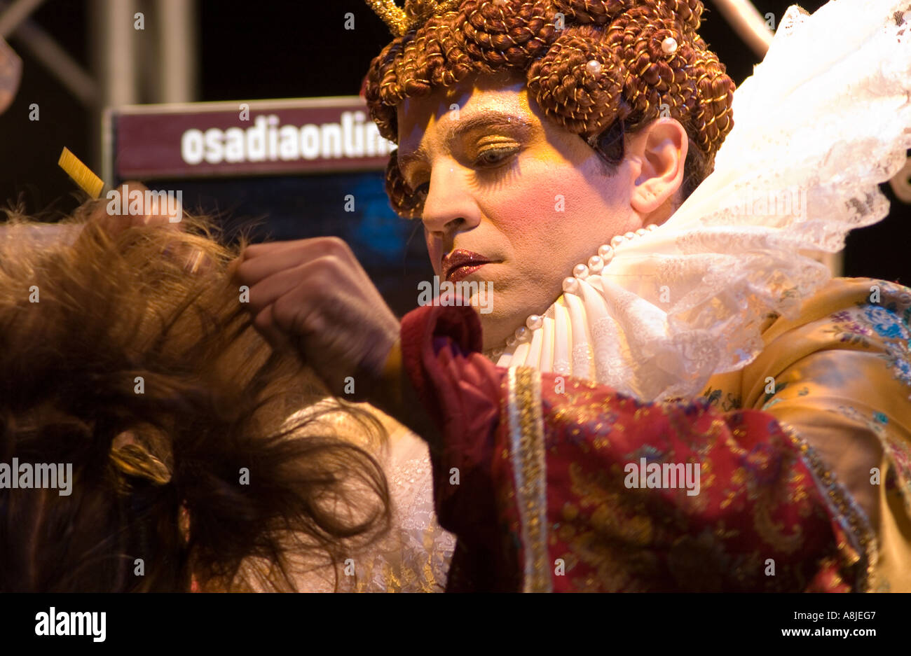 Hair Stylist With Costume Giving A Haircut As Part Of The Hogmanay