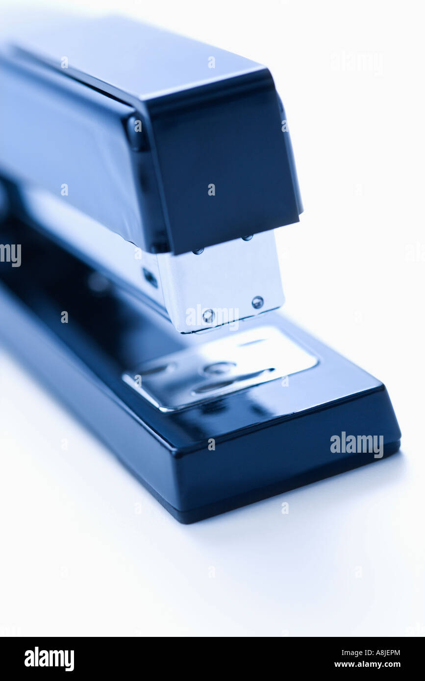Blue stapler on white background Stock Photo - Alamy