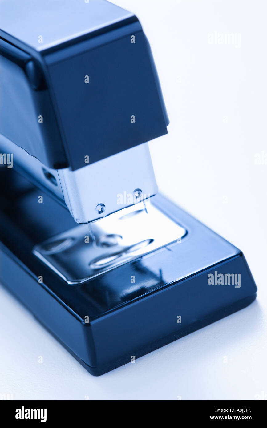 Close up of blue stapler on white background Stock Photo - Alamy