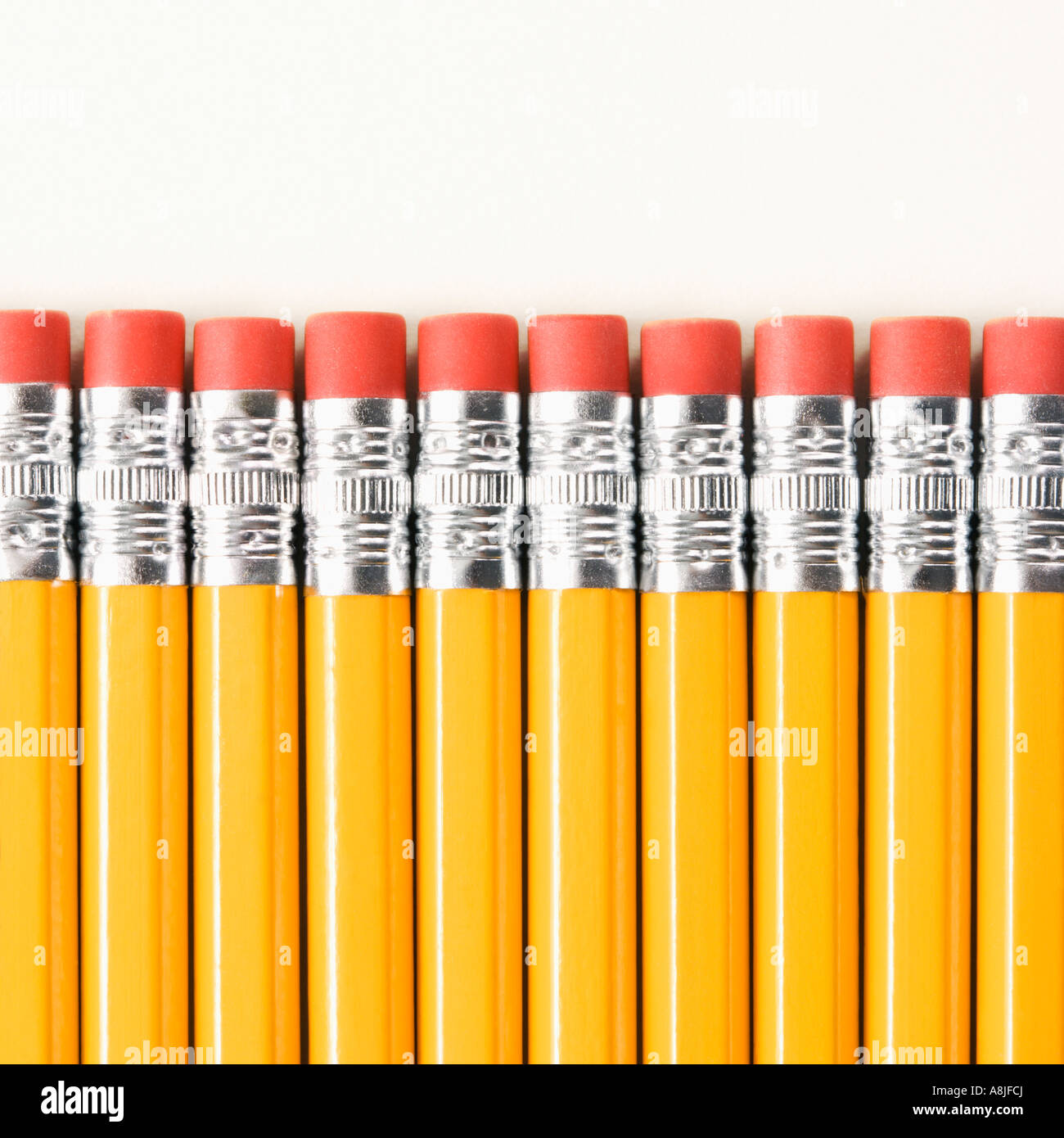Eraser ends of group of pencils lined up in an even row Stock Photo Alamy