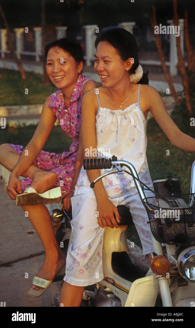 Two girls on a motorbike in Ho Chi Minh City Vietnam Stock Photo - Alamy