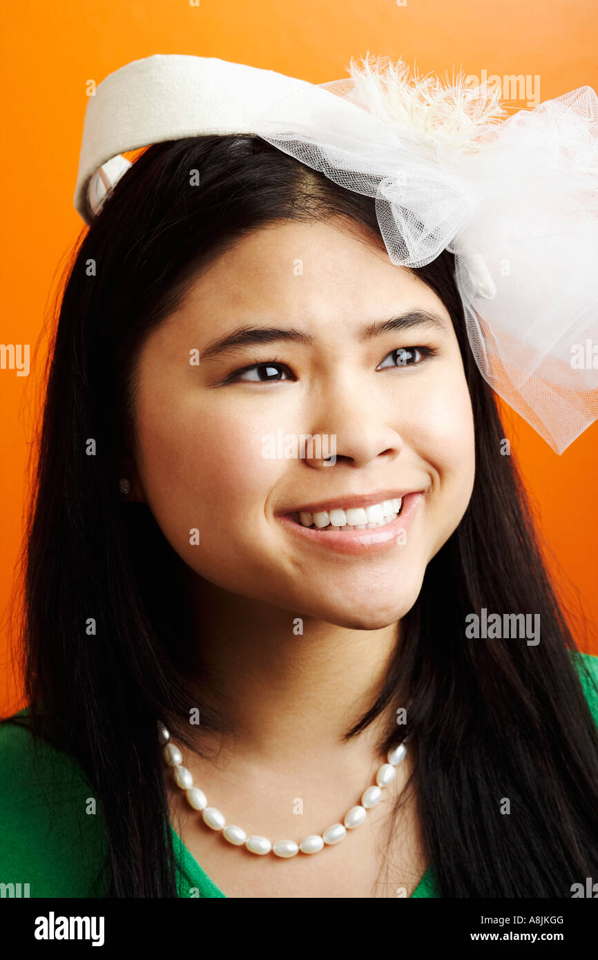 Close-up of a young woman looking away Stock Photo