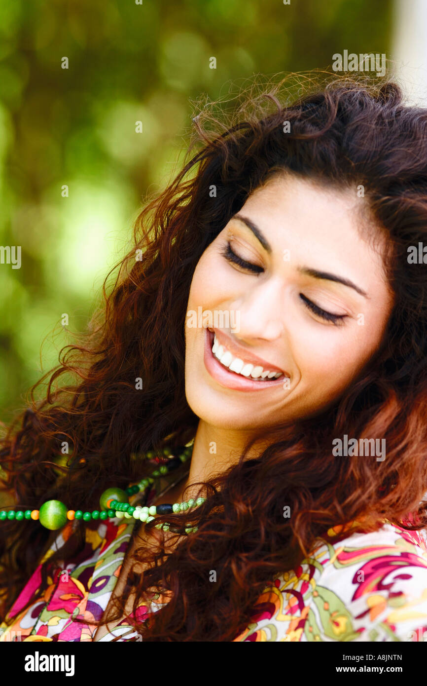 Close-up of a young woman smiling Stock Photo - Alamy