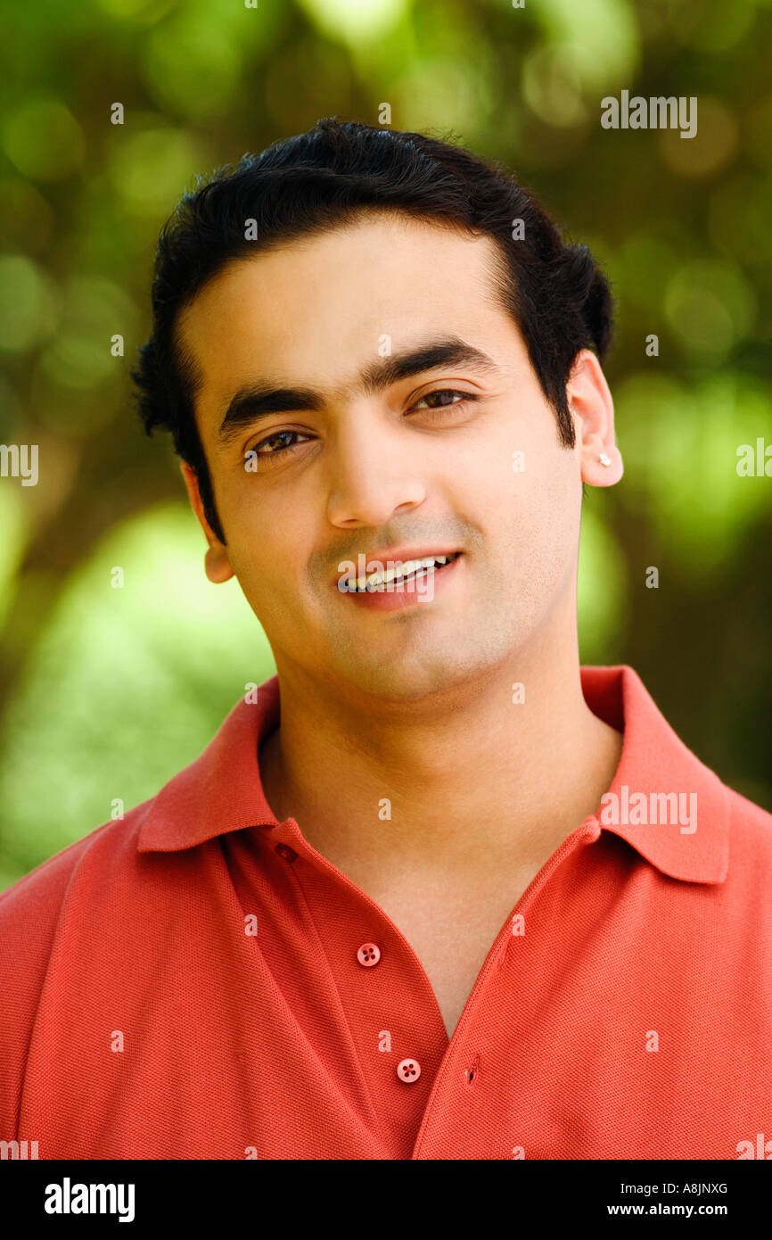 Portrait of a young man smiling Stock Photo - Alamy