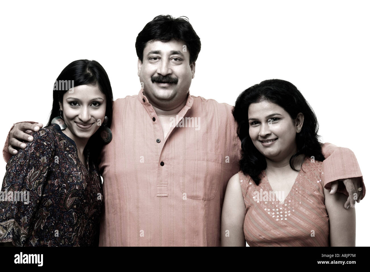 Portrait of a mature man smiling with a young woman and a mid adult ...