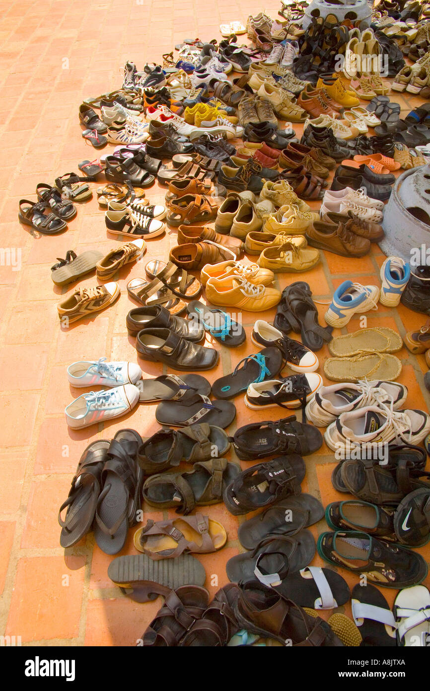 Shoes on bricks outside Vietnamese temple Stock Photo Alamy