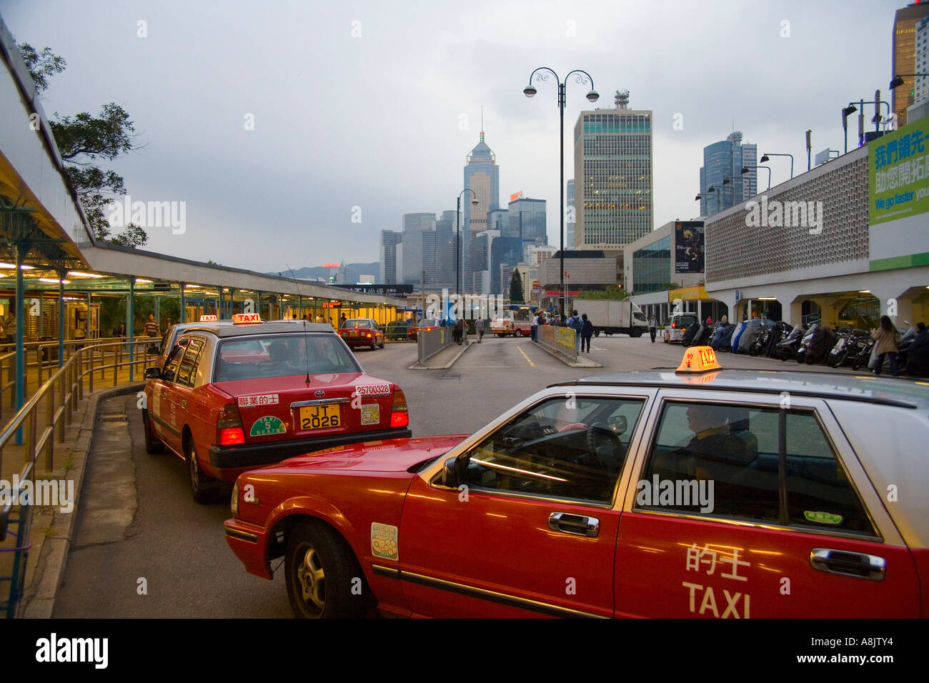 Taxis outside terminal near downtown Hong Kong Stock Photo