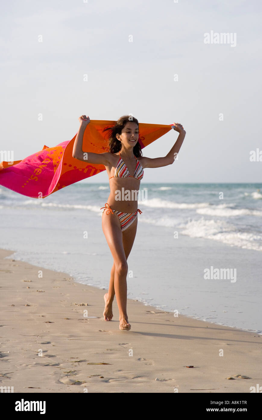 Teenage Girl Running on Beach with Red Beach Towel Tunisia Djerba Stock  Photo - Alamy