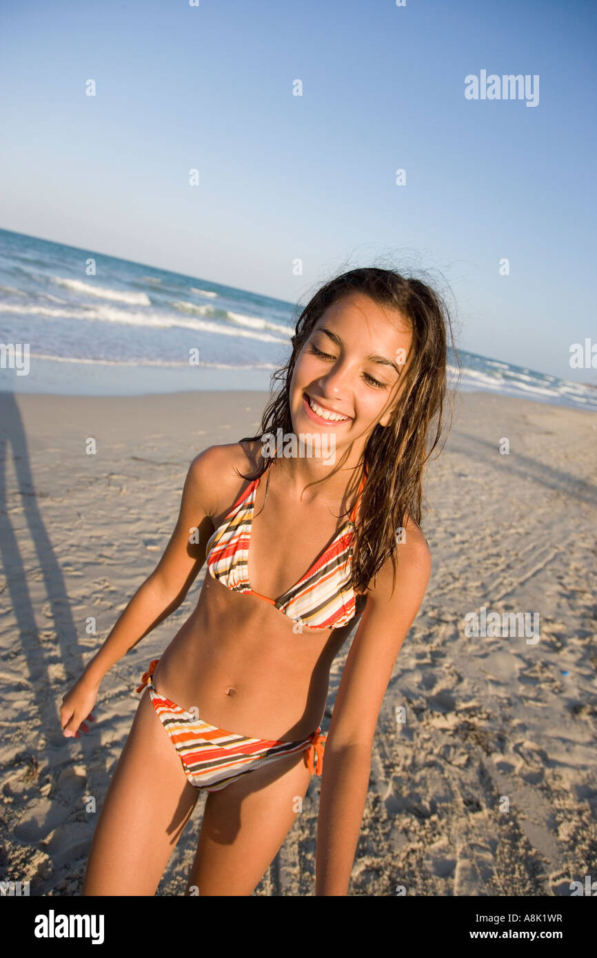 Teenage Girl Wearing Bikini Walking on Beach Stock Photo - Alamy