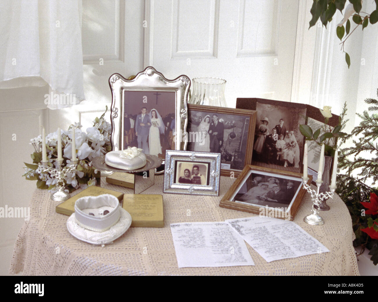 table with family pictures and momentos Stock Photo