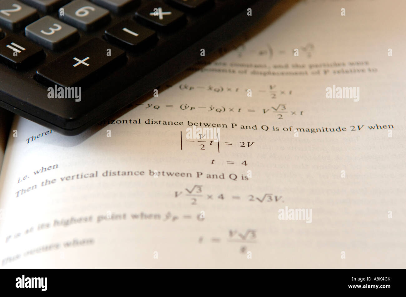 Calculator on maths text book Stock Photo Alamy