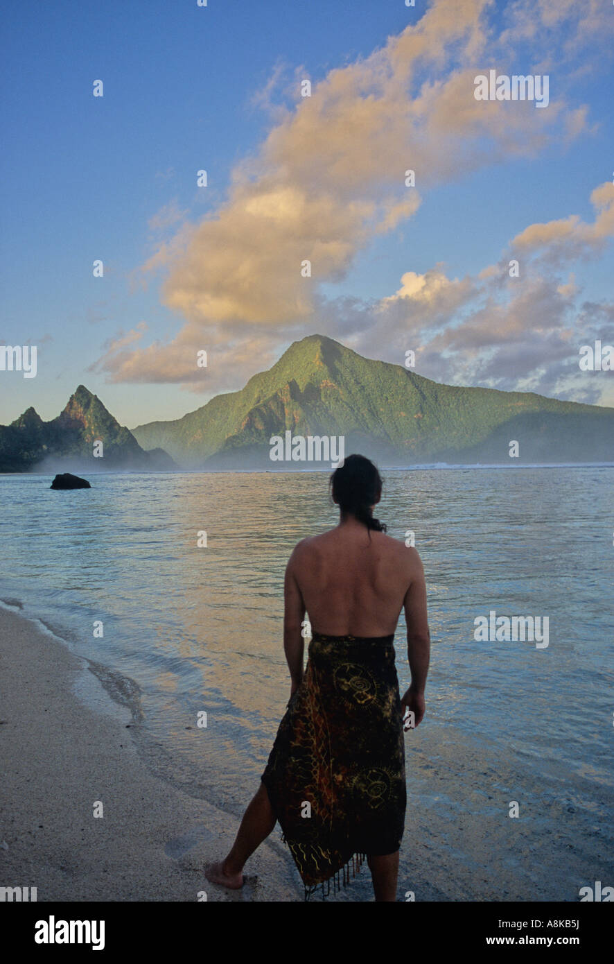 Man at Ofu Beach in American Samoa sees neighboring island Olosega Stock Photo