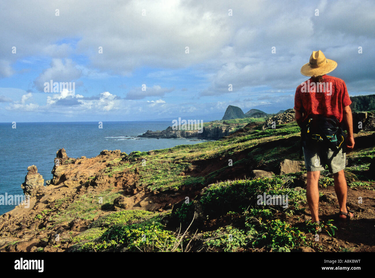 Man hikes the coastal Ohai Trail on Maui Stock Photo