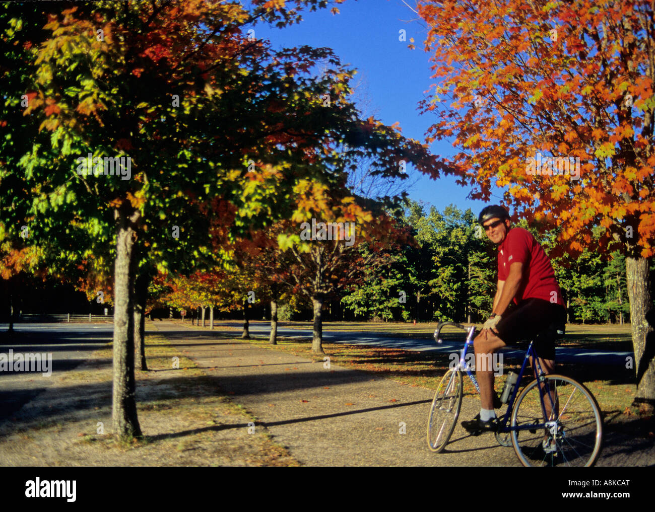 Man on bike outside Batsto Village in autumn Stock Photo Alamy