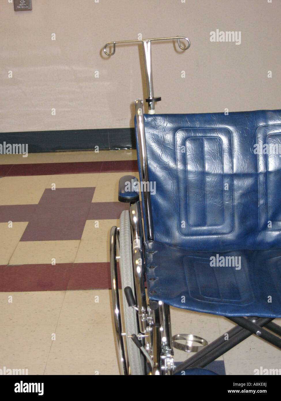 Medical wheelchair with IV pole attached Stock Photo Alamy