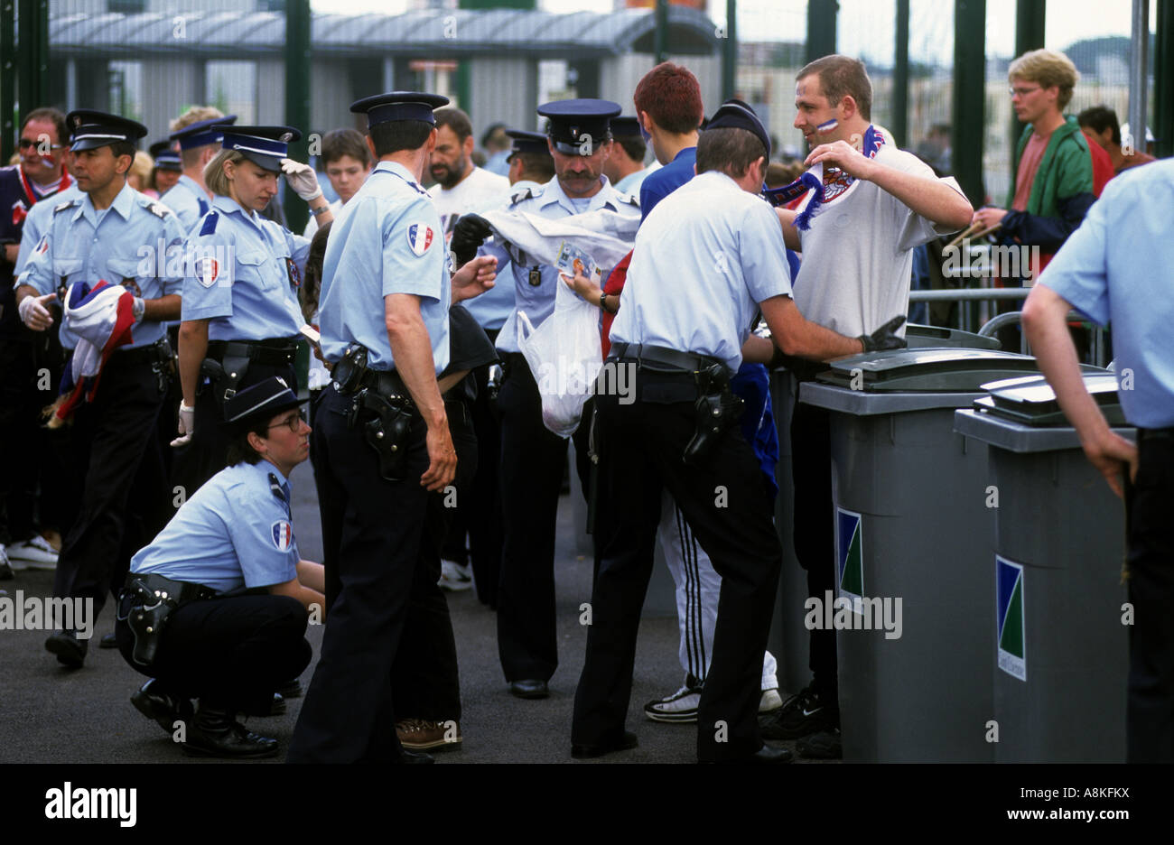French police searching football fans as the enter a stadium during the World Cup finals in 1998. Stock Photo
