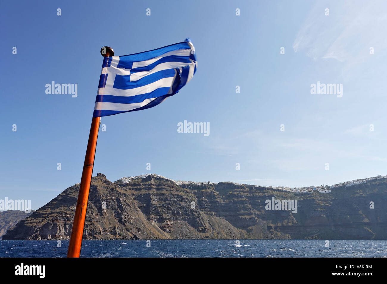 Greek flag and in the background the caldera, Santorini, Greece Stock Photo