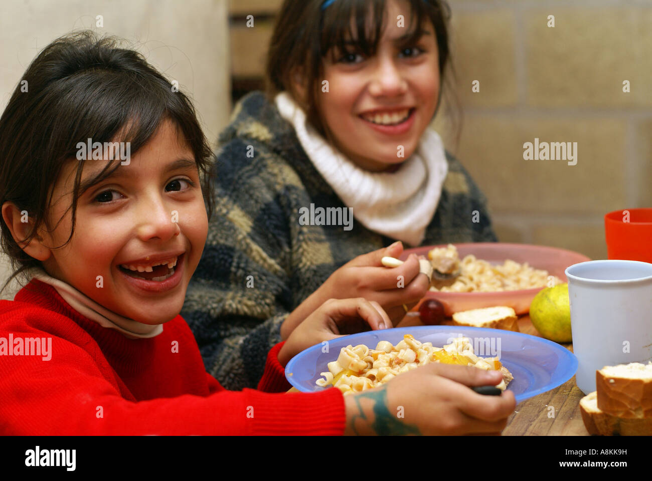 Poor girls in a soup kitchen, Cordoba, Argentine Stock Photo