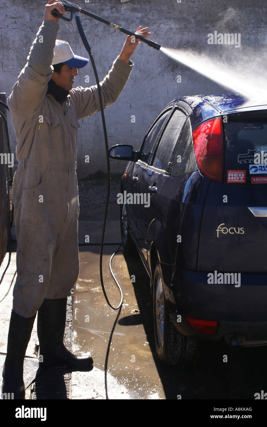 Young man washing a car Stock Photo