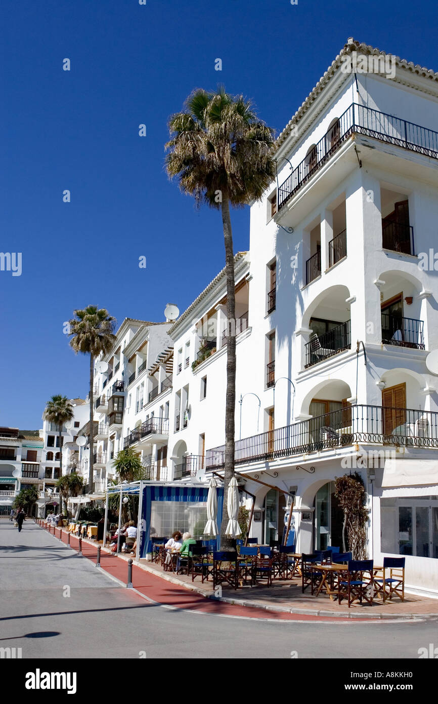 Modern white architecture of apartment block in Duquesa port in spain