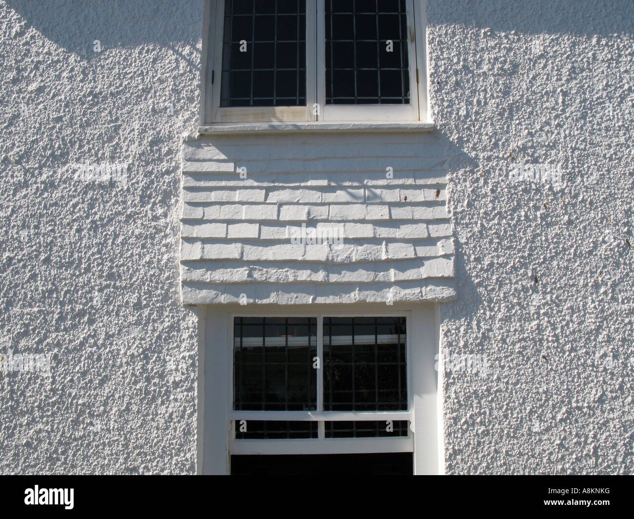 Two windows and white wall on the side of Hotel Tresanton St Mawes Cornwall England UK Stock Photo