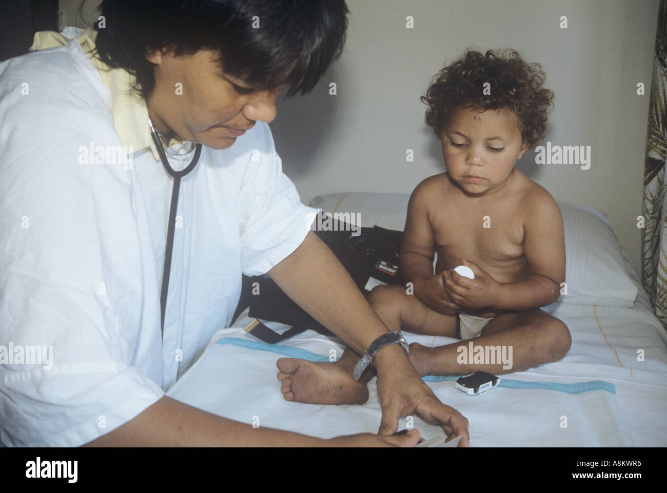 Child receiving treatment, aboriginal clinic in NSW, Australia Stock Photo
