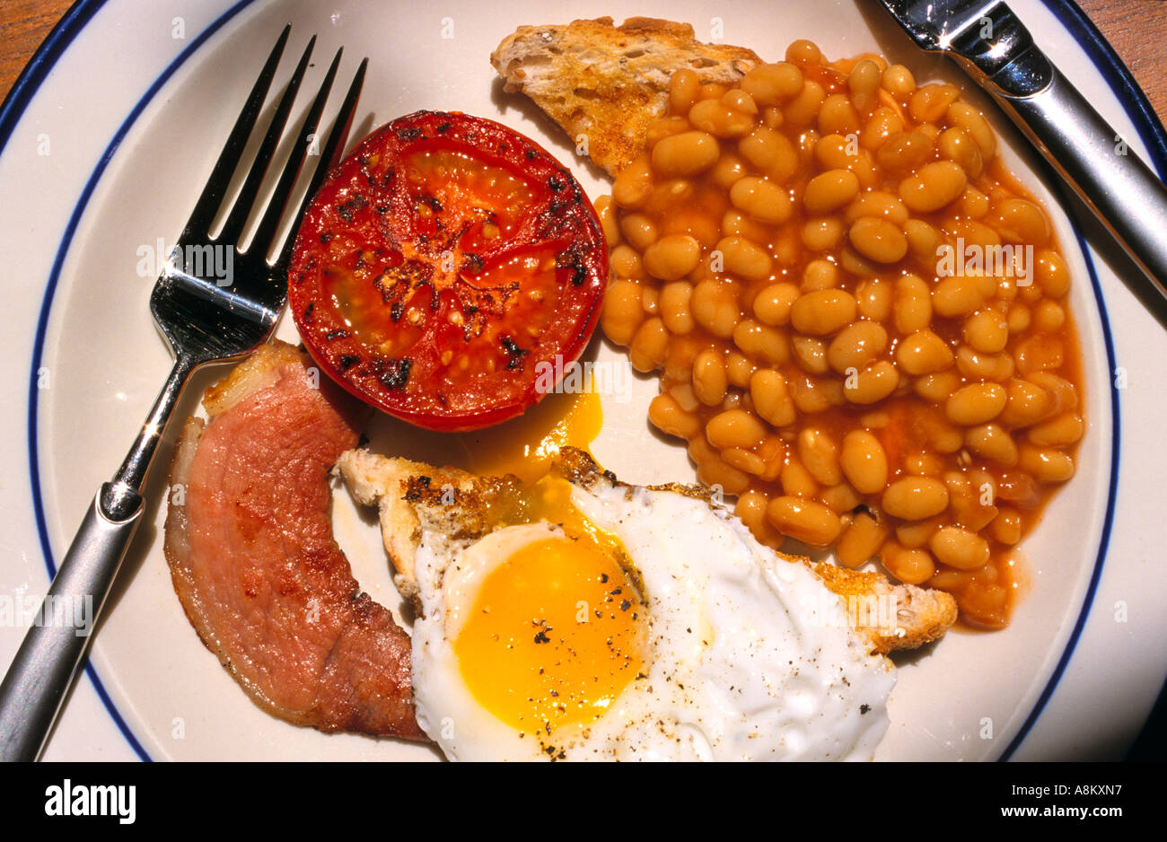 Fried egg with bacon tomato and baked beans on toast Melbourne Victoria