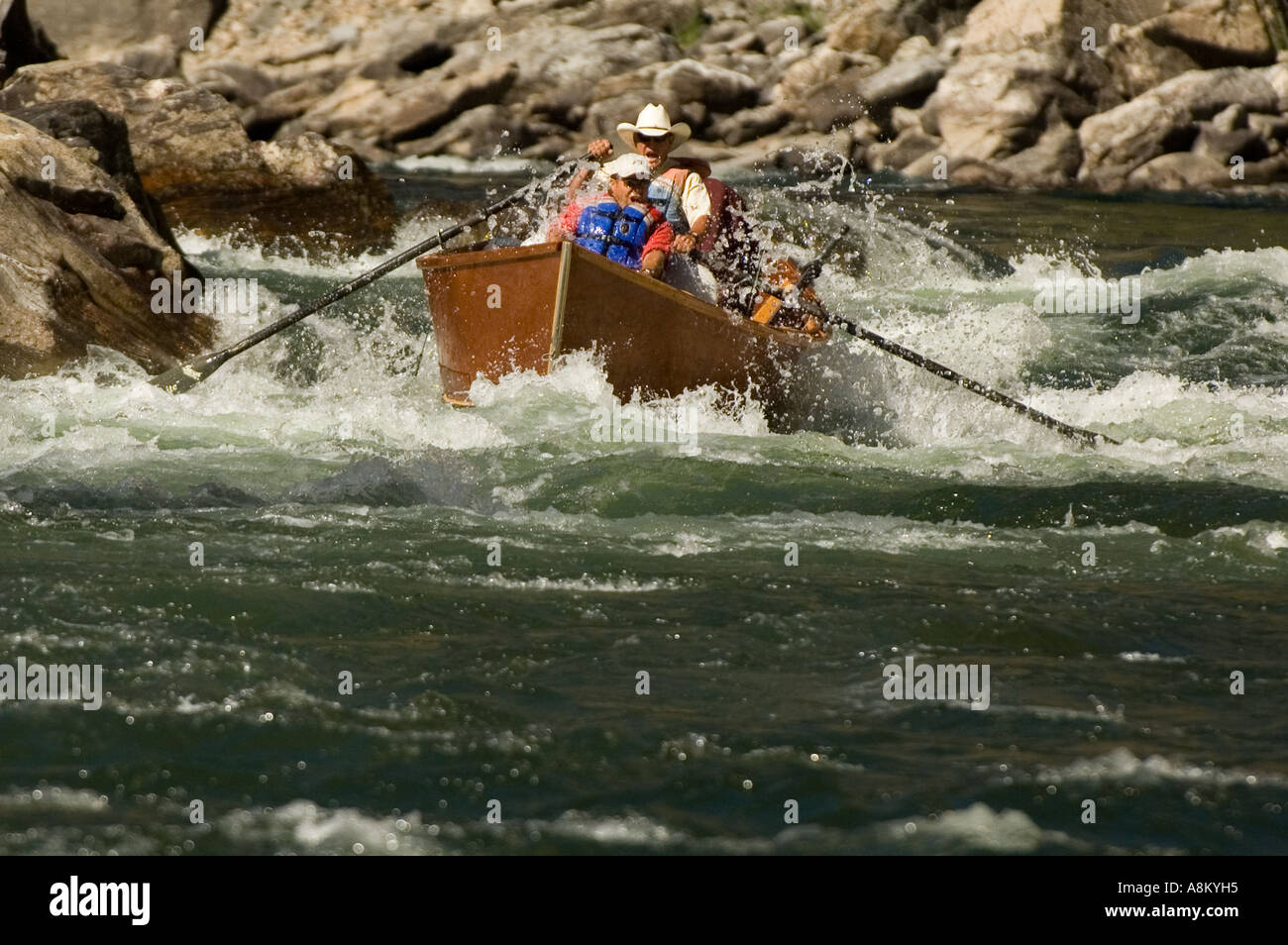 IDAHO MIDDLE FORK OF THE SALMON RIVER Wooden drift boat navigating 