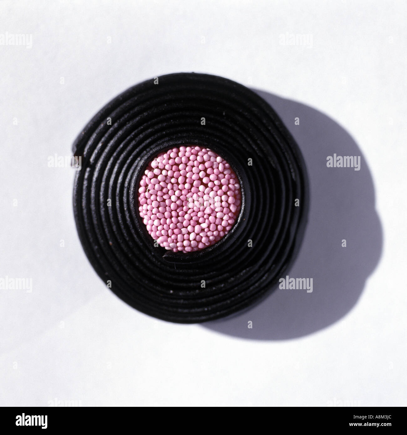 a liquorice catherine wheel sweet Stock Photo