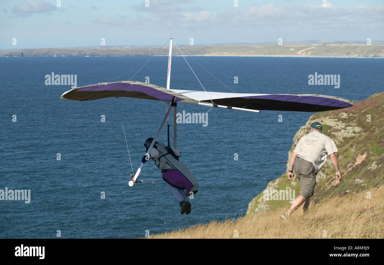 Hanggliding off Atlantic cliffs at St Agnes Head nr St Agnes Cornwall Great Britain Stock Photo