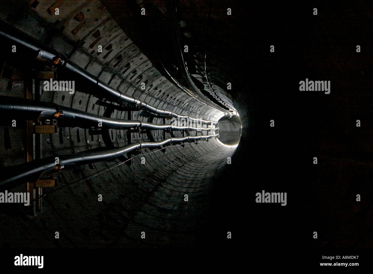 Deep underground electricity transmission tunnel England UK Stock Photo