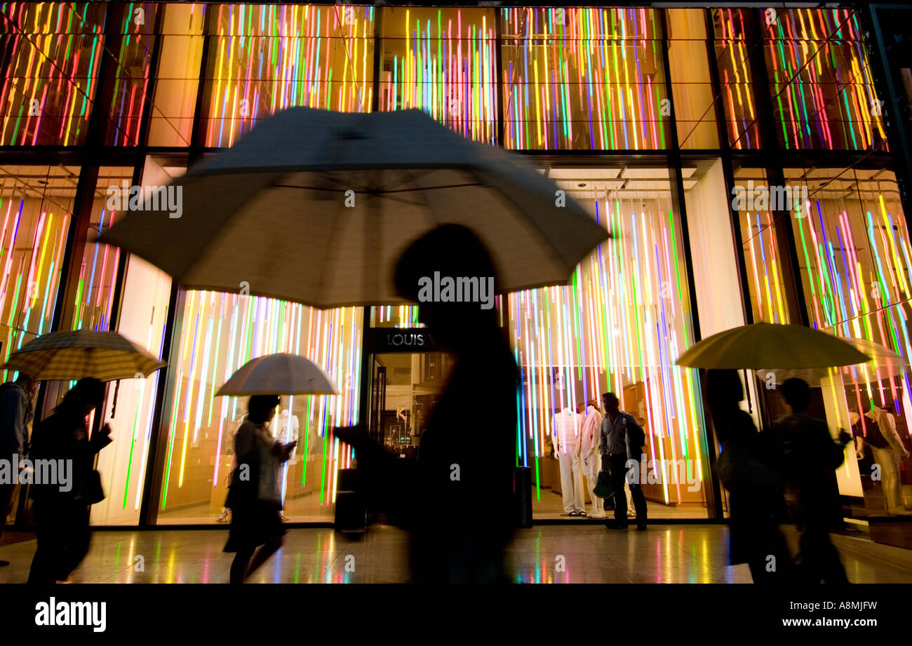 Exterior of spectacular lighting in Louis Vuitton Store at night in rain Omotesando Tokyo Japan Stock Photo