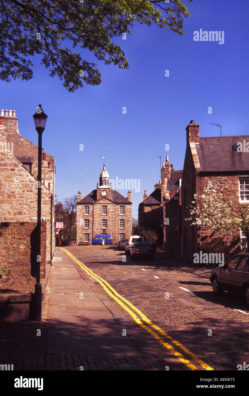 The cobblestoned High Street of Old Aberdeen Scotland with the Town House at the top  Stock Photo