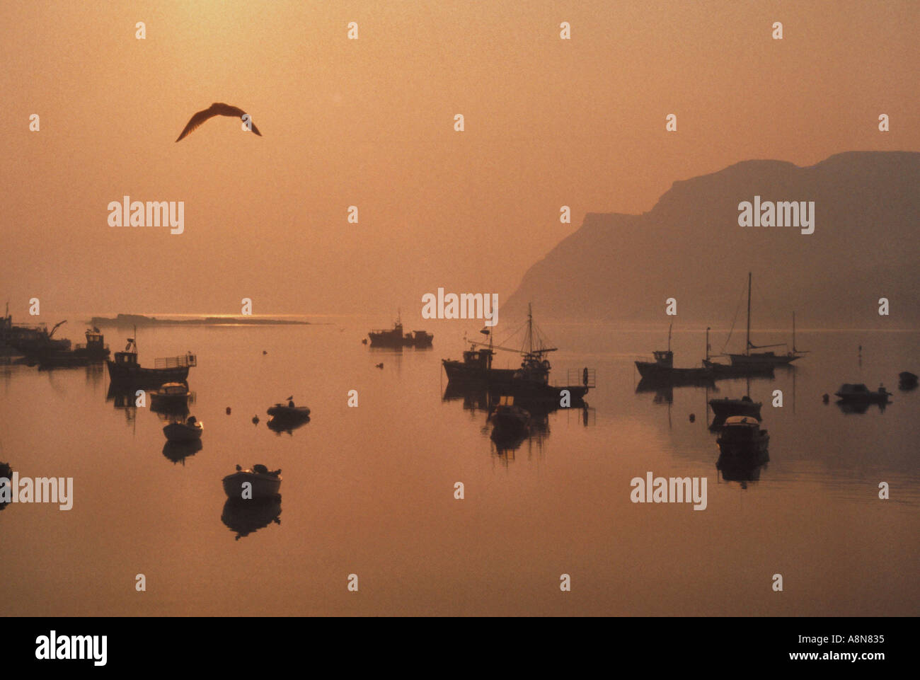 Sunset over Portree Harbour Isle of Skye Scotland Stock Photo
