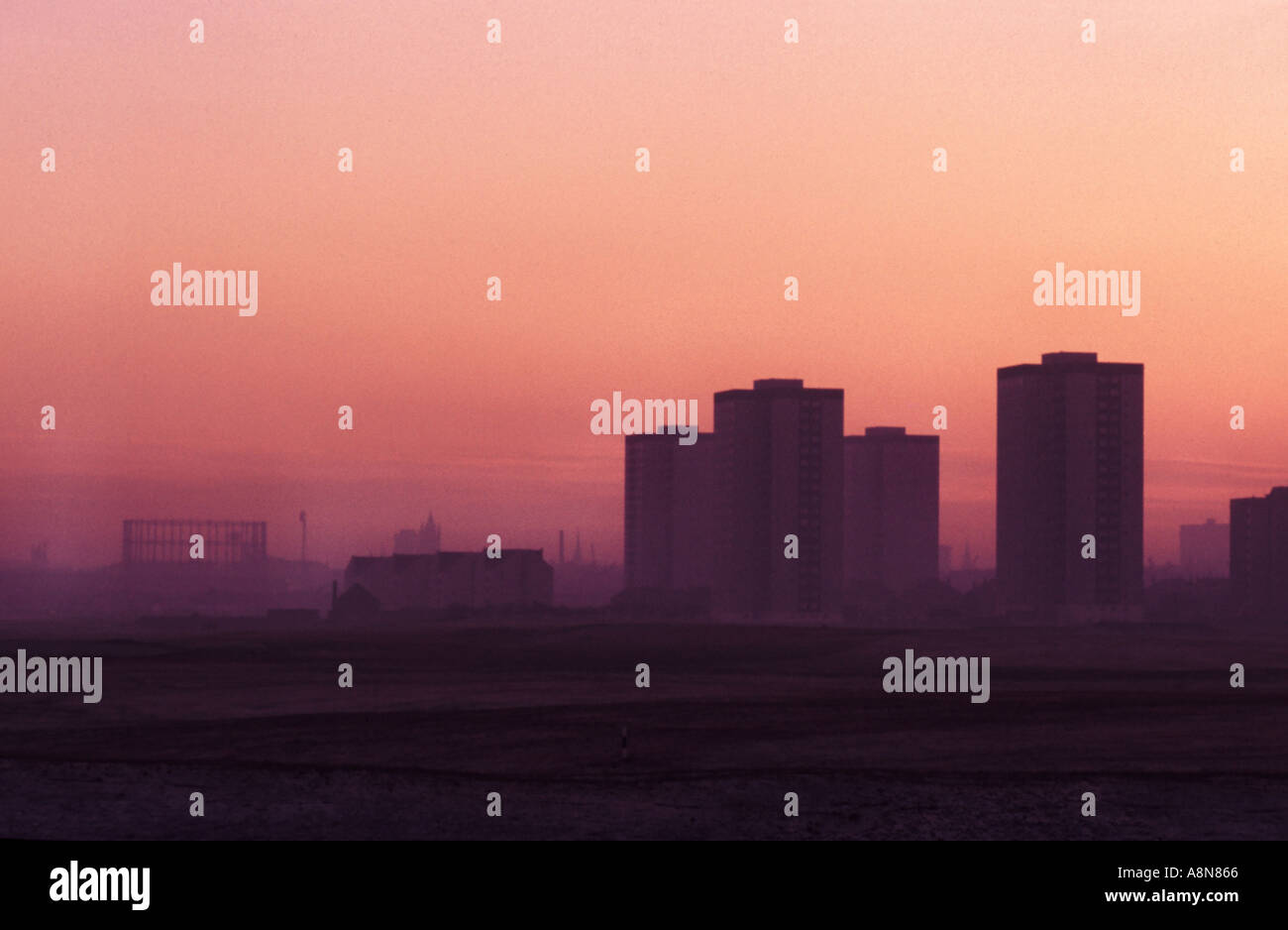 Sunset over tower blocks near the shore in Aberdeen Scotland Stock Photo