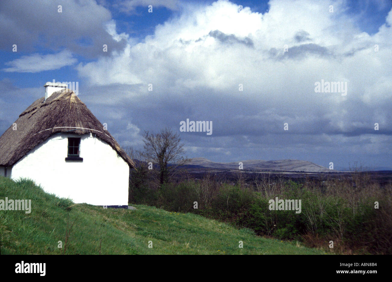 Traditional Irish thatched cottage overlooking Mullaghmore Co Clare Ireland Stock Photo