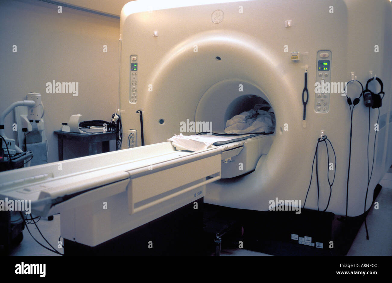 Magnetic Resonance Imaging MRI machine being used to scan and diagnose a four year old girl Stock Photo
