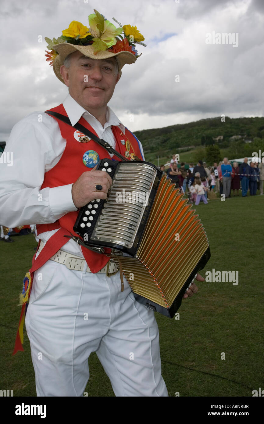 Gloucestershire Morris Man playing accordion for dancing on May Day at