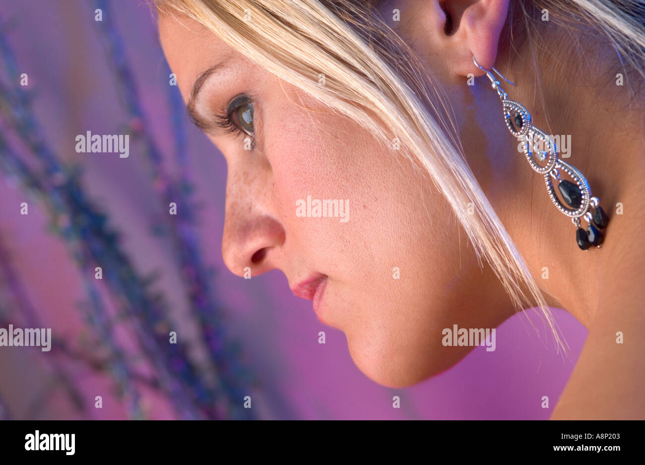 Girl wearing earrings hi-res stock photography and images - Alamy