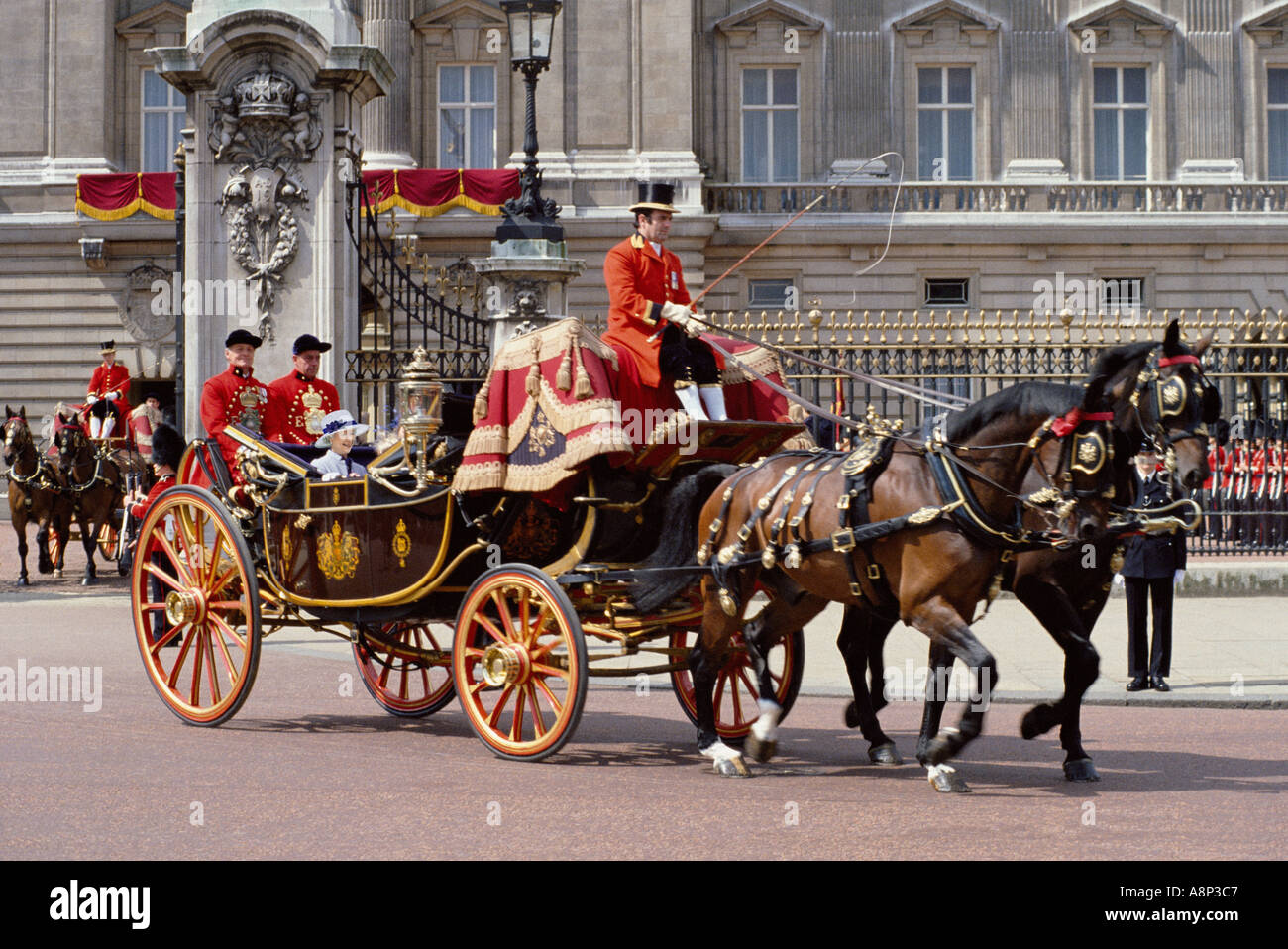 Royal carriage and Queen Elizabeth II leaving Buckingham Palace Stock Photo