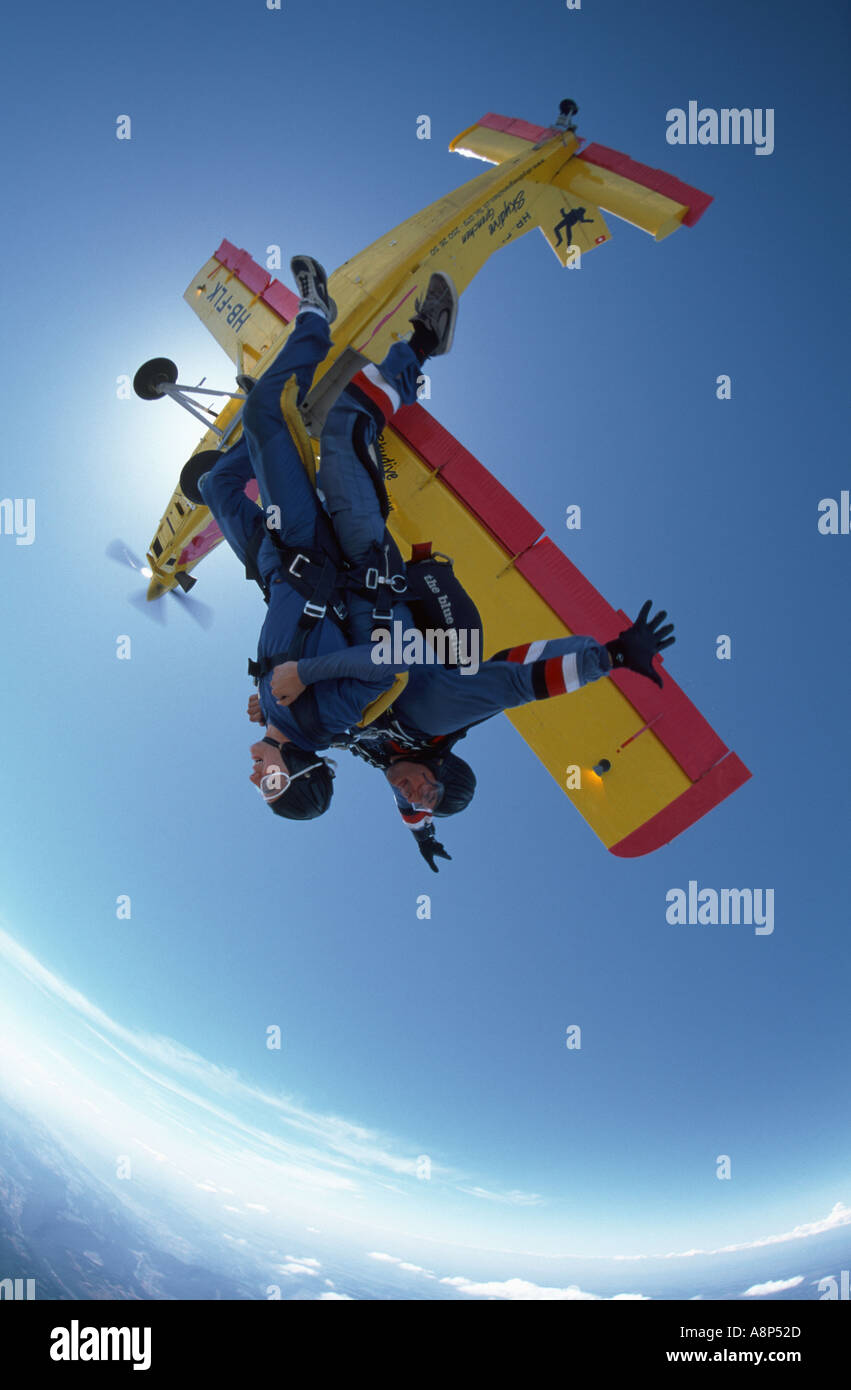 Tandem instructor taking a women for her first Skydive Stock Photo